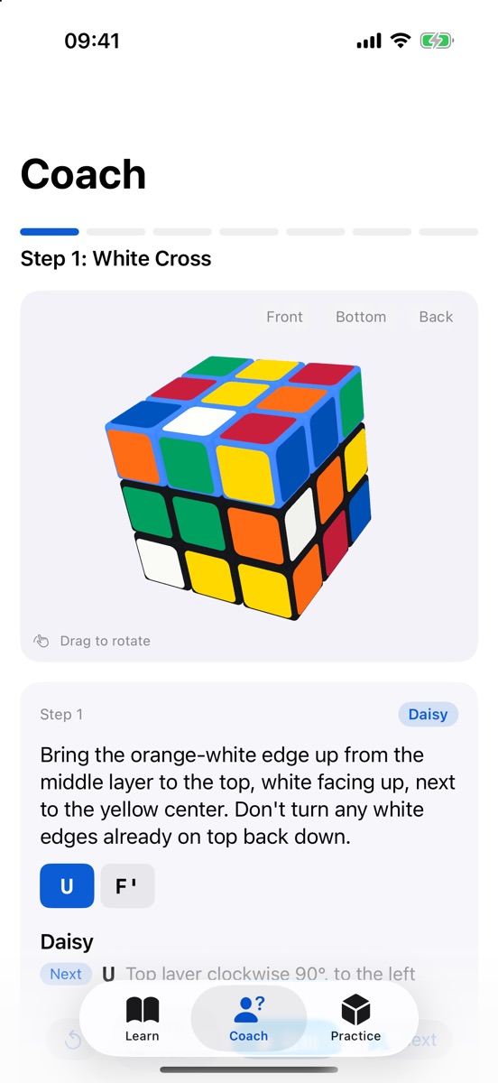 The coach guiding a scrambled cube through the white cross